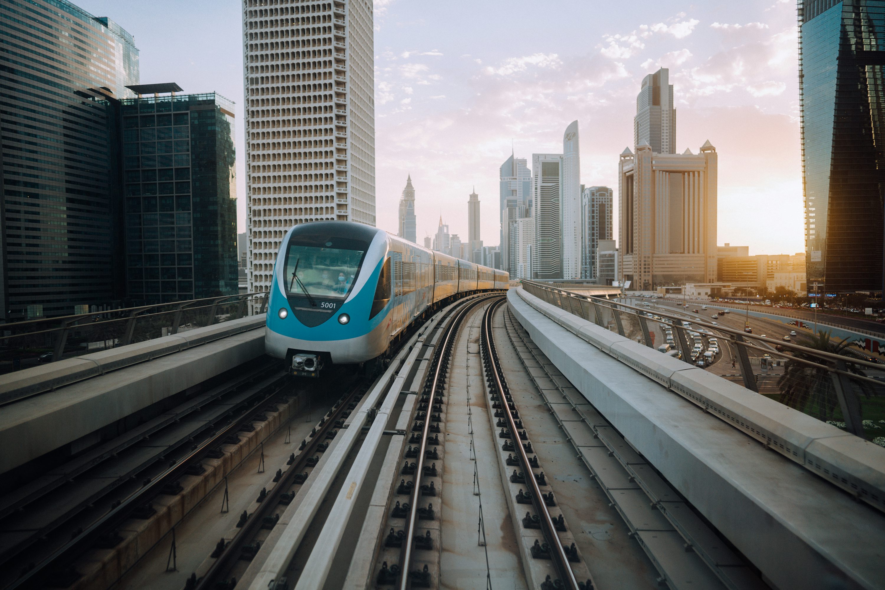 Dubai Metro train on elevated tracks among the city skyline